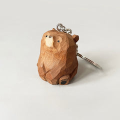 Side view of adorable wooden bear keychain with metal ring