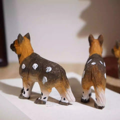 Rear view of african wild dog figurine
