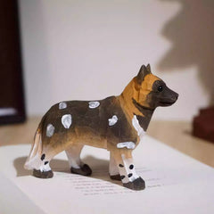 Side view of african wild dog figurine