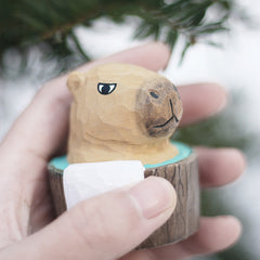 Close-up of hand-painted wooden capybara figurine details