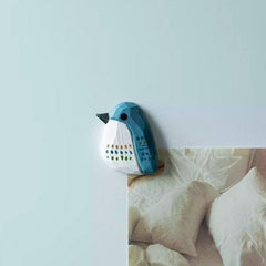 Blue bird wooden fridge magnet on refrigerator