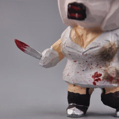 Bubble head nurse wooden figurine close up of hand painted knife and dress