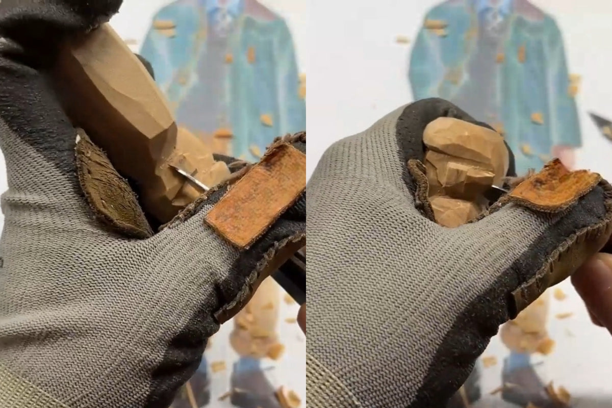 Carving the ears and back of the head on a wooden gift figure with attention to size and placement.