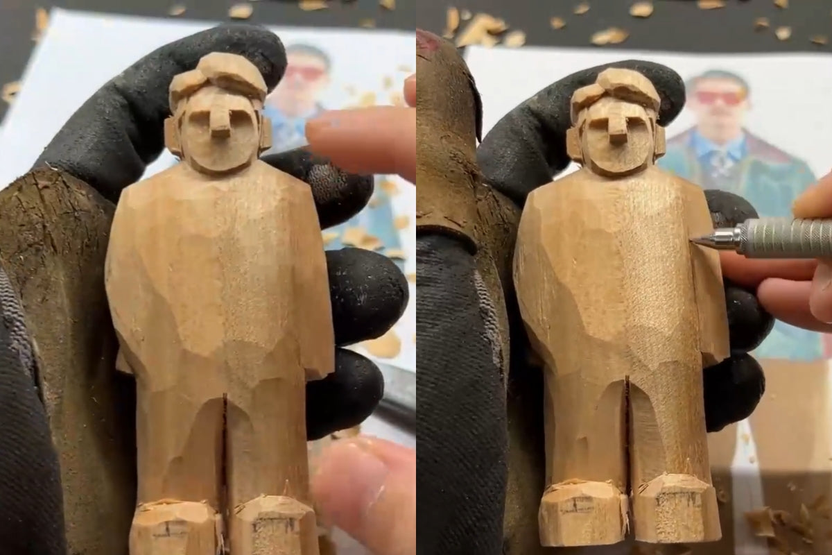 Marking and carving the separation line between the figure’s torso and right arm for body detailing.