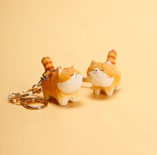 Chubby orange wooden cats