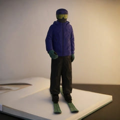 Custom ski figurine hand carved from wood, full front view of personalized wooden skier sculpture