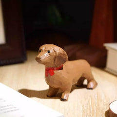Dachshund figurine with red collar
