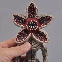 Close-up of Demogorgon figure’s flower-shaped mouth, highlighting detailed carving and paintwork.