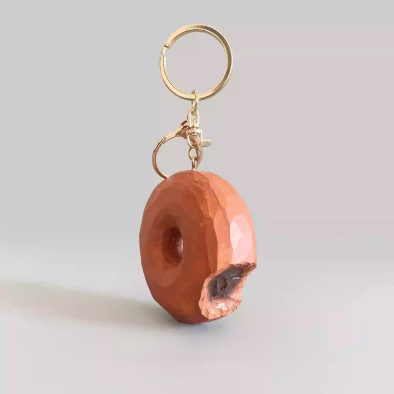handmade wooden donut keychain with carved bite detail