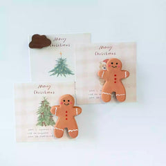 Gingerbread man fridge magnets holding notes