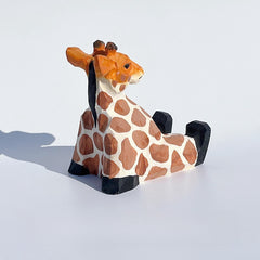 Back view of the wooden giraffe cell phone holder.