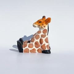 Svn Futures  giraffe, hand carved and painted for cell phone holder.