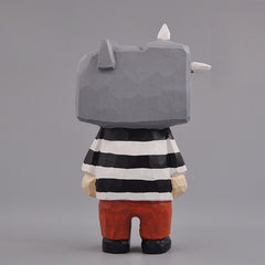 Side view of Guernica-style wooden figure with cubist features and striped shirt.