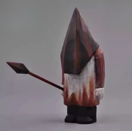 Hand-carved wooden pyramid head statue