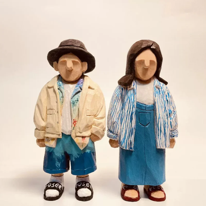 hand-carved wooden couple figurines