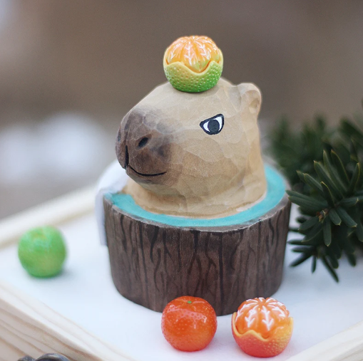 wooden hand-crafted bathing capybara