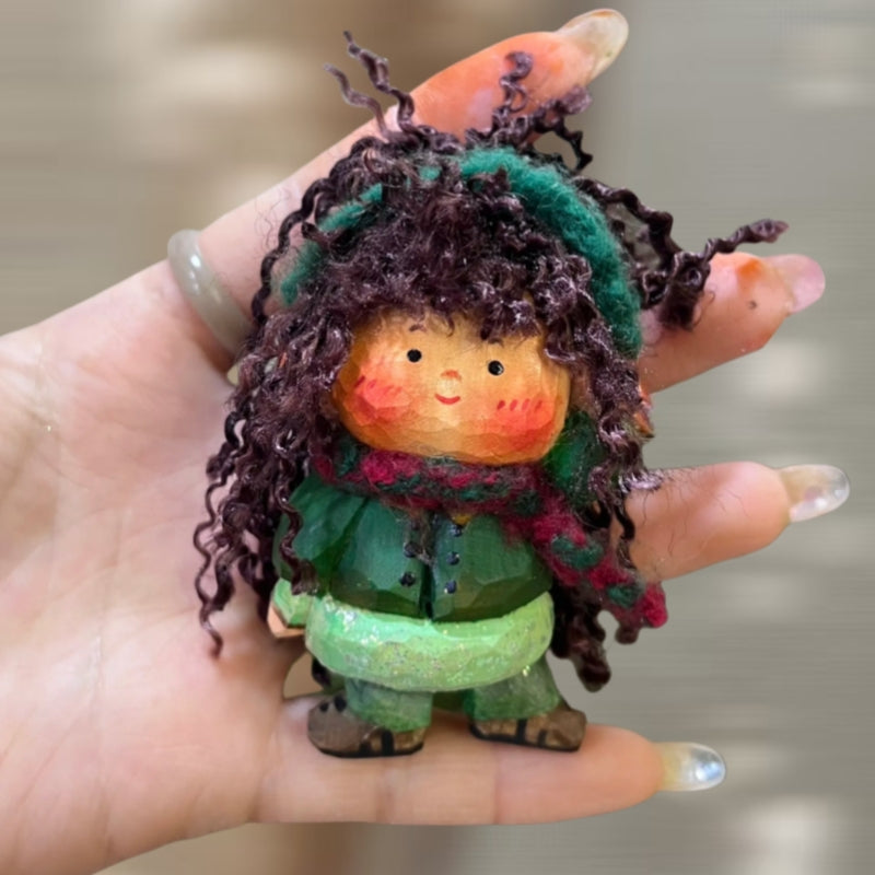 Handcrafted wooden doll keychain with green scarf and curly yarn hair, small wood doll carved by hand