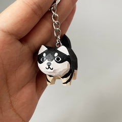 Husky wooden keychain in hand