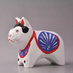 Side view of inu hariko wooden figurine