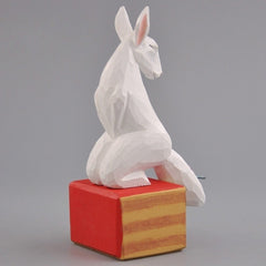 Back angle of hand-carved wooden kitsune figurine