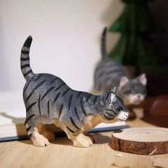 Side view of long tail cat figurine