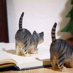 Back view of long tail cat wooden figurine