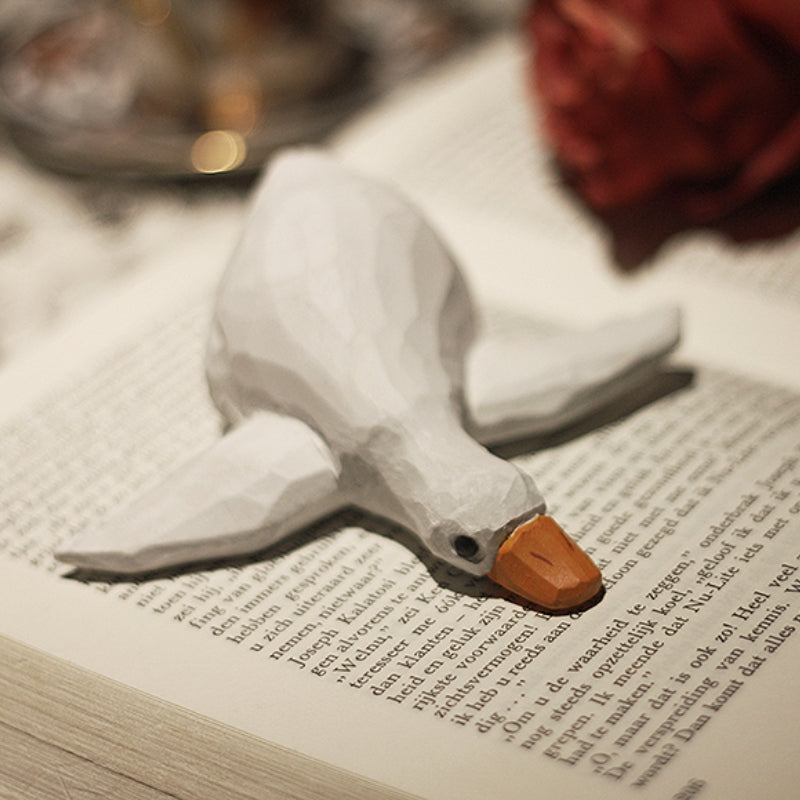 Lying wooden duck figurine