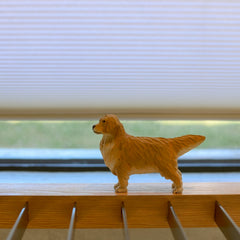 Miniature golden retriever figurine display