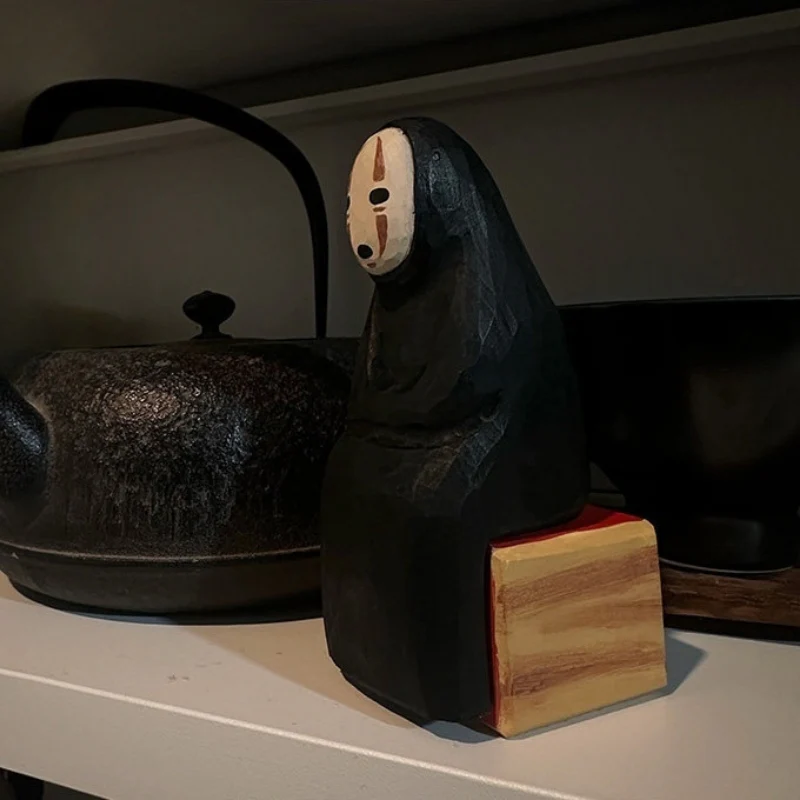 No Face wooden sculpture with base