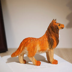 Side view of hand carved sheltie dog figurine