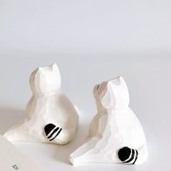 Back view of split pose cat figurine