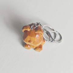 Hand-carved teddy bear wooden keychain detail