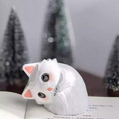 Tilted head cat wooden figurine