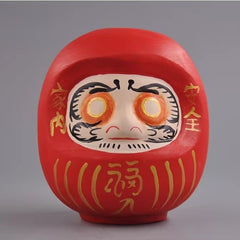 Red Japanese daruma doll wooden figurine