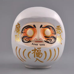 White Japanese daruma doll wooden figurine