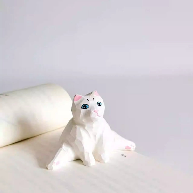 White cat wooden figurine in split pose