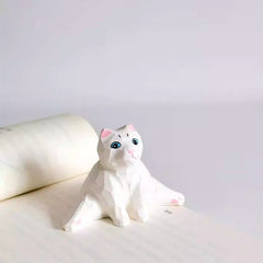 White cat wooden figurine in split pose
