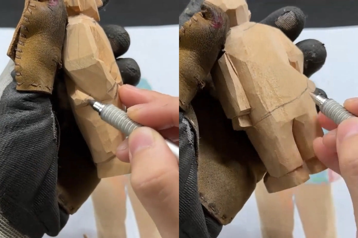 Sketching the coat edge on an unfinished wooden figurine, preparing for continuous clothing fold carving on wood sculpture.
