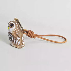 wooden owl keychain on backpack