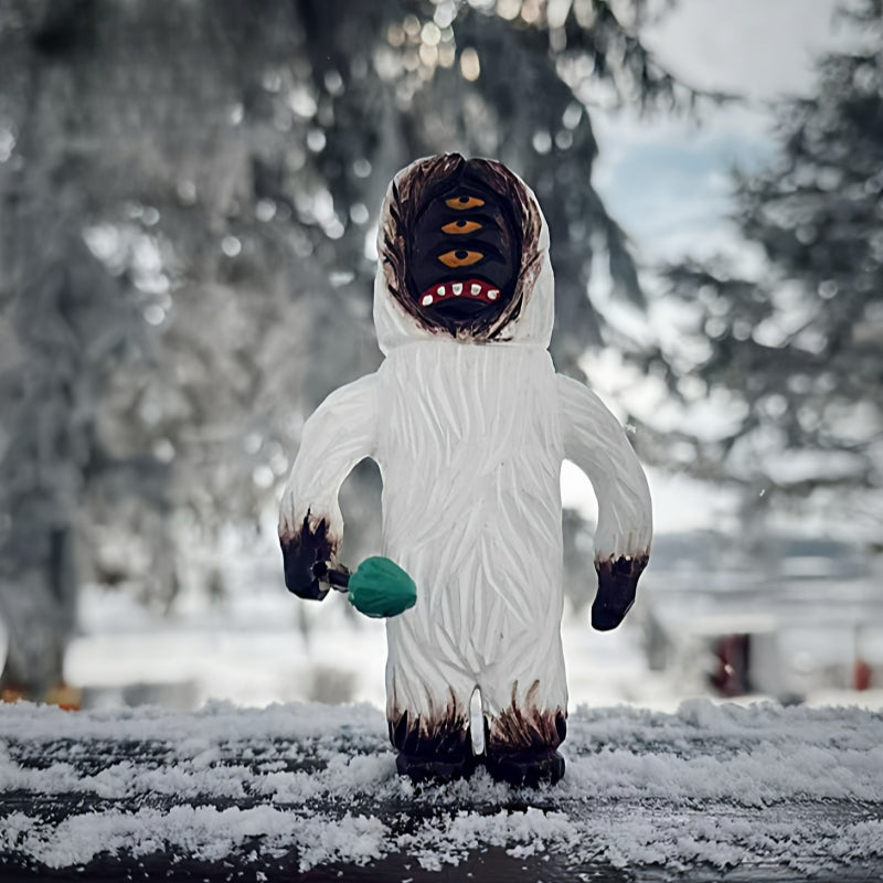 Yeti figurine with a multi-eye face
