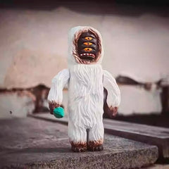 Yeti figurine carved multi eye face detail